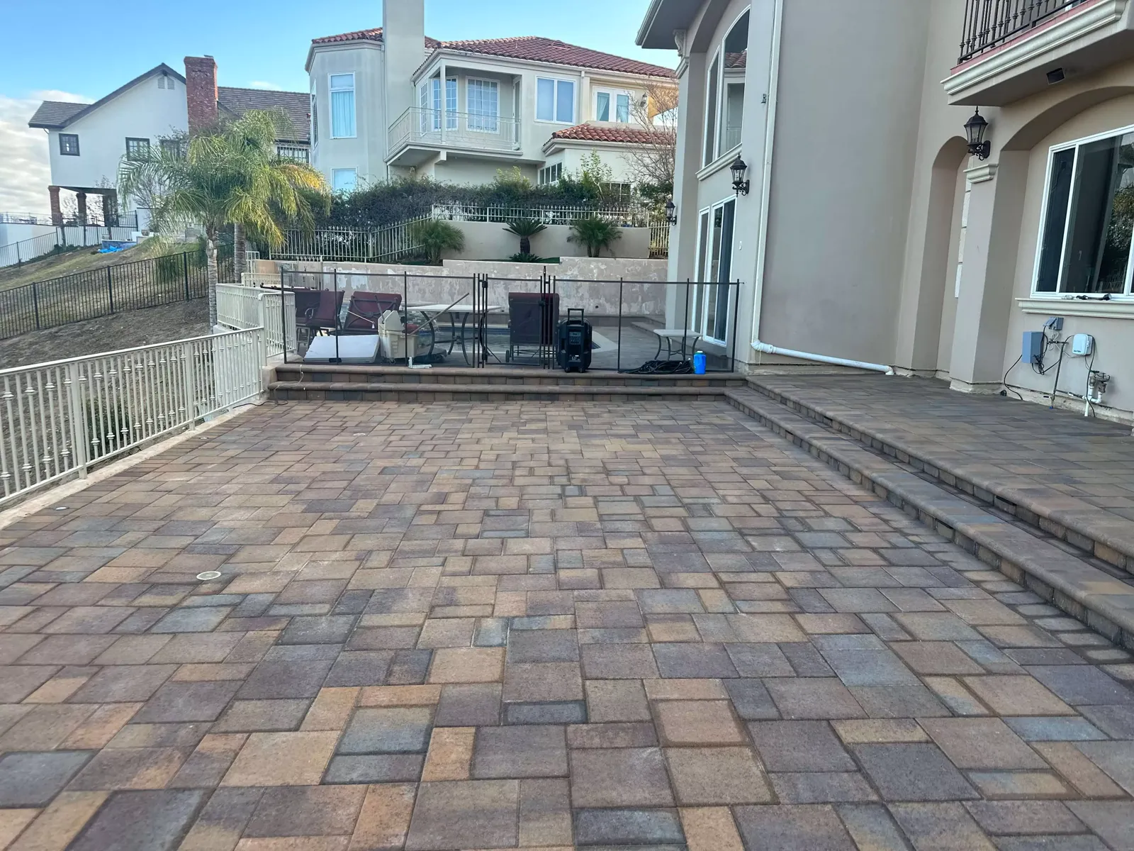 Two-story home with new multi-tone pavers